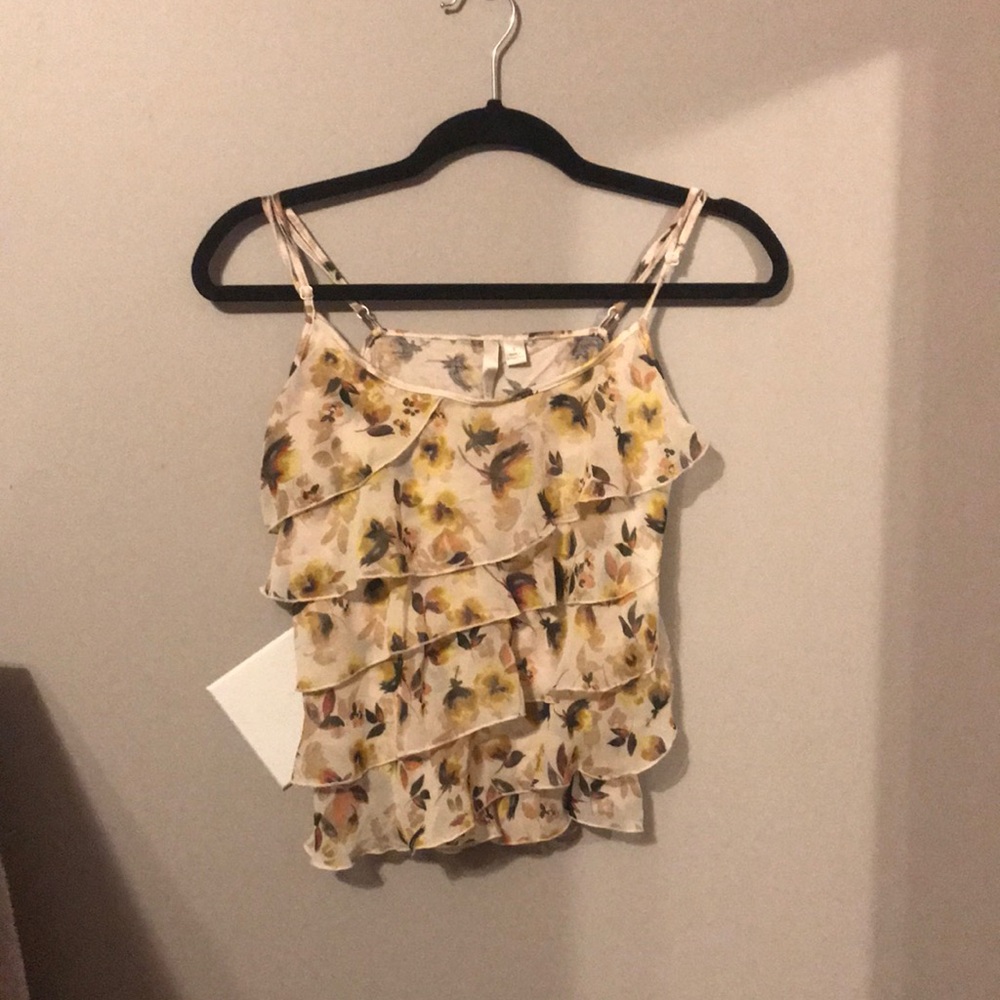 Blouse with yellow flowers on it